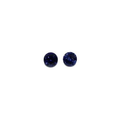 Elegant blue sapphire pair showcasing vibrant, deep blue hues with brilliant faceting, perfect for fine jewellery or gemstone collections.